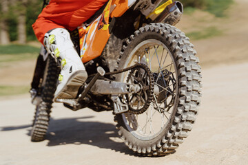 Fototapeta na wymiar Close up motorbike. Extreme and Adrenaline. Motocross rider in action. Active lifestyle.
