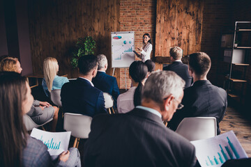 Businesspeople attending business meeting listening to reporter presenter finance plan data...