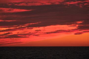 Naklejka na ściany i meble Red fire blood sunset sky cloudscape seascape