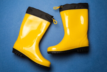 pair of bright yellow rubber boots