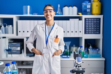 Young african american woman scientist smiling confident standing at laboratory