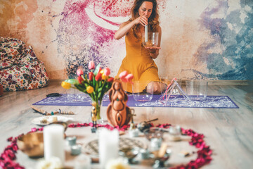 soundhealing, beautiful woman playing crystal bowls on cacao ceremony.