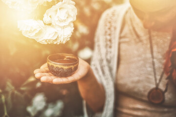 Cacao ceremony in the garden, heart opening medicine. Ceremony space. Rose background.