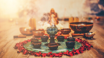 Beautiful altar with rose petals and incense. Cacao ceremony space. - obrazy, fototapety, plakaty