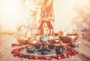 soundhealing, beautiful woman playing crystal bowls on cacao ceremony.