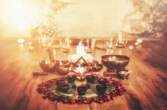 Beautiful altar with rose petals and candle. Cacao ceremony space.