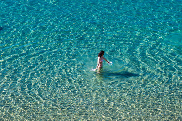 woman walking im the sea 