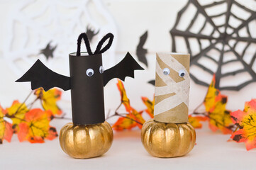 Halloween decoration from toilet paper roll, handmade vampire bats, mummy, pumpkin. easy paper crafts for kids. Selective focus.