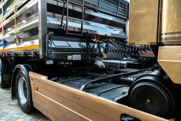Spiral cable connecting truck cabin and trailer. Pneumatic hoses and electric cables on the coupler...