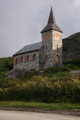 Fototapeta na wymiar Grense Jakobselv, Norway - August 4, 2022: King Oscar II Chapel on Kafir's Road is a parish church of the Church of Norway in Sor-Varanger Municipality in Troms og Finnmark county. Selective focus
