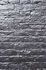 Texture of a black brick wall