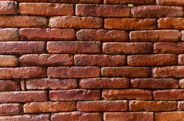 The texture of a wall made of red bricks.