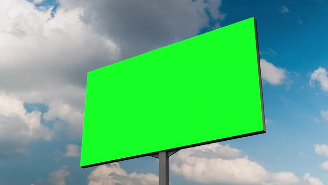 Timelapse - blank green billboard or large display and moving white clouds against blue sky. Green screen, consumerism, time lapse, advertising, template, mock up, copyspace and chroma key concept