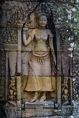 Cambodia. Siem Reap. The archaeological park of Angkor. A bas relief of Devata at Bayon Temple 12th century Hindu temple