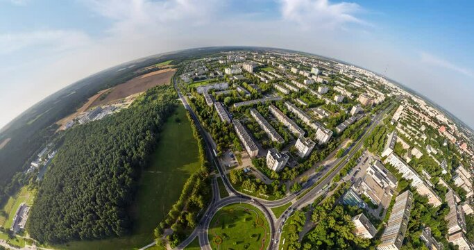 circular rotation with twisting of the landscape of the city from the height of the flight into a tiny planet