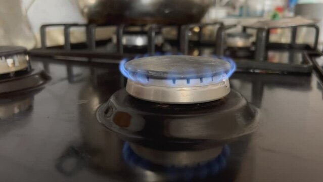 Due to the shortage and high cost of gas, a small blue flame of natural gas burns on the stove in the kitchen, which is not enough for cooking. Insufficient gas combustion pressure on the stove. 