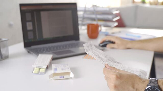 For a treatment, the drug user reads the prospectus.
An office worker reading the prospectus of the drug at his desk in the office.
