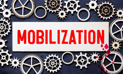 The word mobilization and soldiers on a light background. Mobilization in Russia