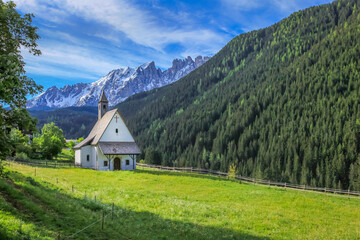 Fototapeta na wymiar Alpine Church, chapel in Dolomites alps near Bolzano, Italy