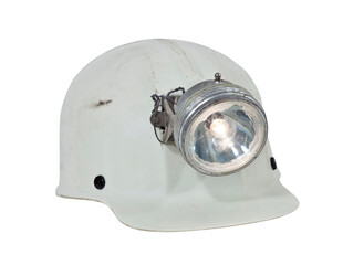 Vintage caving and mining hard hat with lamp isolated.