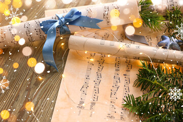 Christmas composition with music note sheets on wooden table