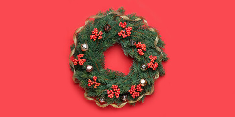 Beautiful Christmas wreath with mistletoe on red background, top view
