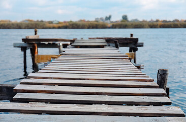 Fototapeta premium Wooden pier pathway near river, closeup