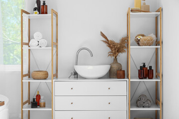 Modern sink and shelf units with bath accessories near white wall