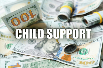 Child support concept. Many dollar banknotes as background, closeup