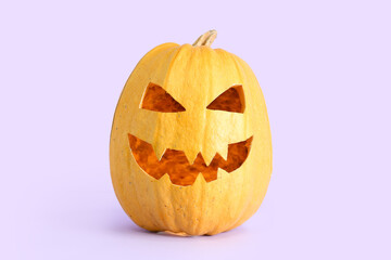 Jack-O-Lantern pumpkin on lilac background
