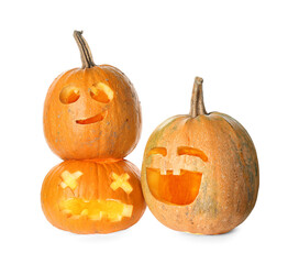 Carved Halloween pumpkins on white background