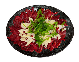 Appetizing fresh meat carpaccio from thinly sliced raw veal served with cheese and fresh fragrant...
