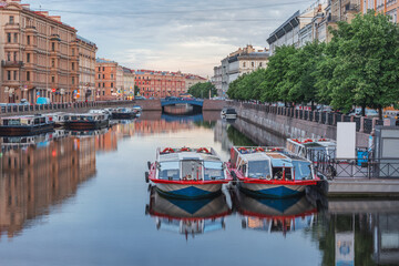 Fototapeta na wymiar Excursion boats in the historical city center. Saint Petersburg.