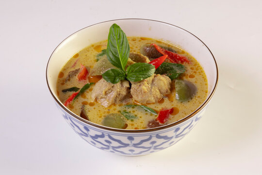 Thai food, green curry chicken with coconut curry isolated on a white background