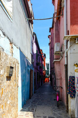 Fototapeta na wymiar Alley in the colorful city of Burano, Venice, Italy