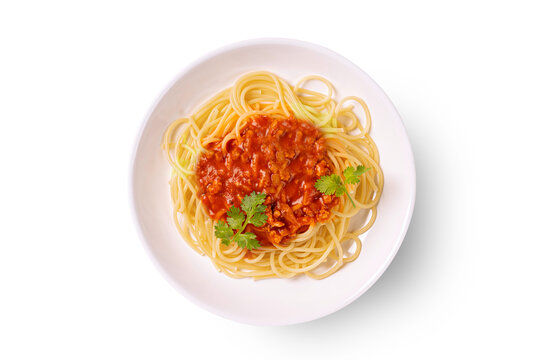 Spaghetti bolognese on white plate isolated on white background. Top view
