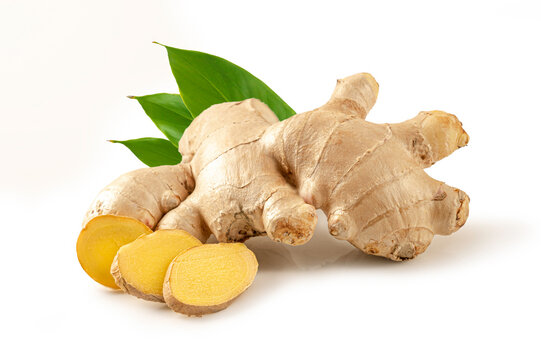 Ginger with slices and leaves isolated on white background