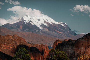 illimani seen in the middle of a beautiful canyon beautiful mountains