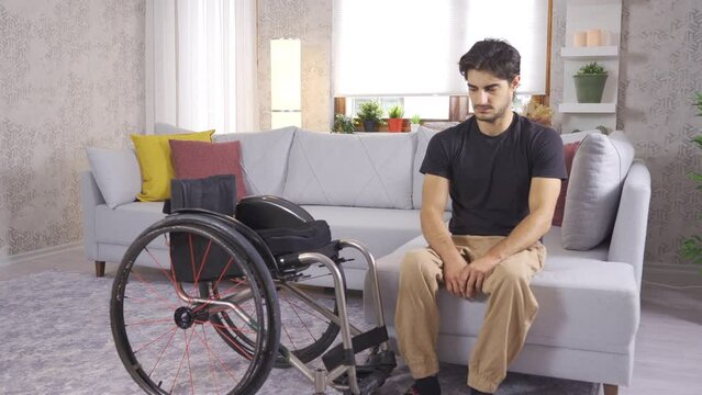 Disabled teenager in wheelchair is thoughtful and depressed at home.
Disabled mature man sitting in wheelchair and in living room at home.

