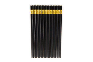 black chopsticks with golden ornamentation isolated on white background