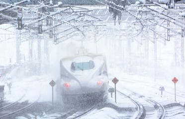 Tokaido Shinkansen N700S passing through Maibara station at snowy day