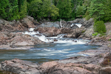 Naklejka na ściany i meble Chippewa Falls, seen here from the bottom just off the Trans Canada Highway, is one of many waterfalls along the north shore of Lake Superior.