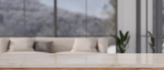 White marble tabletop with empty space in front of blurred modern living room with comfortable sofa