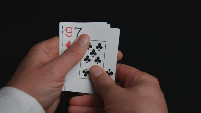 Close-up of playing cards poker combinations on black background high card