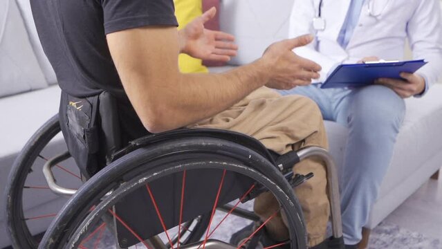 Disabled man talking to doctor in slow motion.
Doctor Helps Disabled Patient Regain Strength. Slow Motion.
