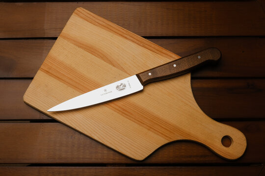 A picture of Victorinox wood handle carving knife on wooden table.