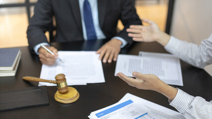 Client describes the money fraud problem and discusses the solution with a lawyer in the litigation...