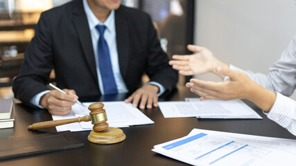 Client describes the money fraud problem and discusses the solution with a lawyer in the litigation...