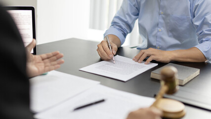 Lawyer or judge has recommend a client sign a legal agreement in the courtroom, Legal Agreement...