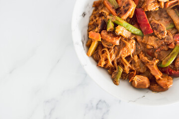 healthy plant-based food, vegan stir-fry vegetables with vermicelli noodles and satay sauce